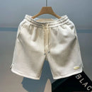 Shorts de corrida masculinos, leves, com estampa de ondas e secagem rápida.