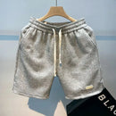 Shorts de corrida masculinos, leves, com estampa de ondas e secagem rápida.