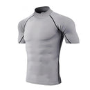 Camiseta de compressão masculina, esportiva, com secagem rápida e mangas curtas.